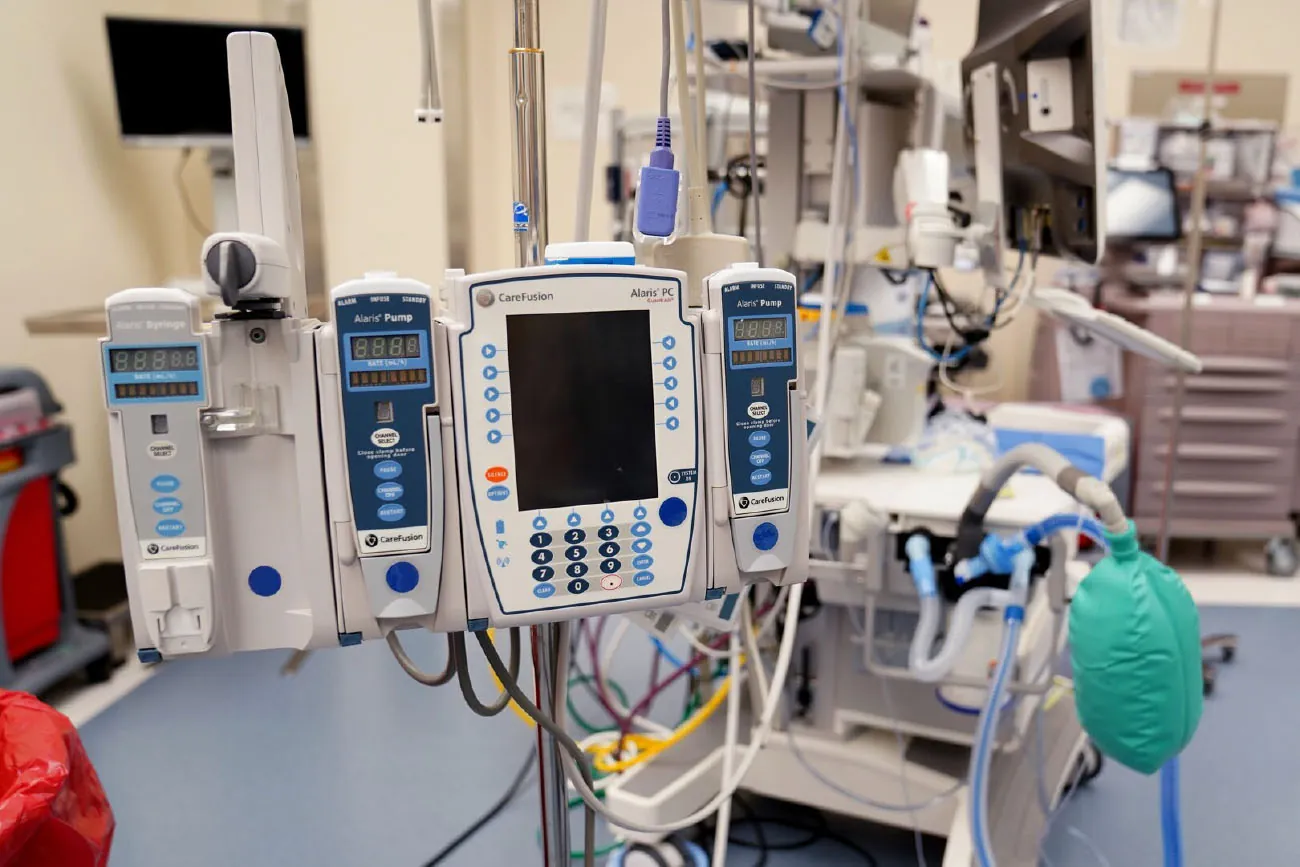 A photograph showing an infusion pump in a medical setting.
