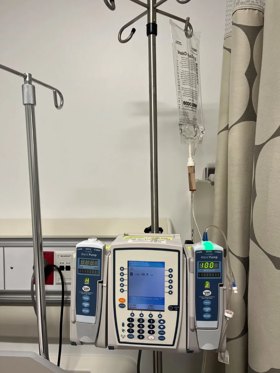 A photograph shows an electronic IV pump.