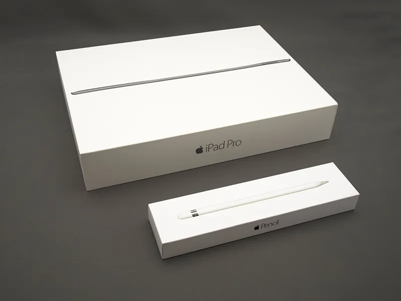 The box for an iPad Pro is behind the box for an iPencil.