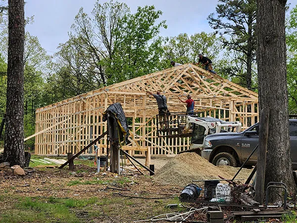 A group of construction workers working on a building.