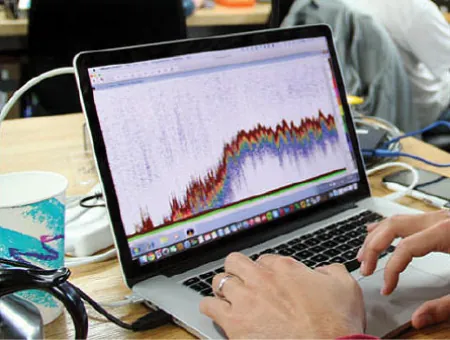 Photo of a laptop displaying an analysis using various colors.