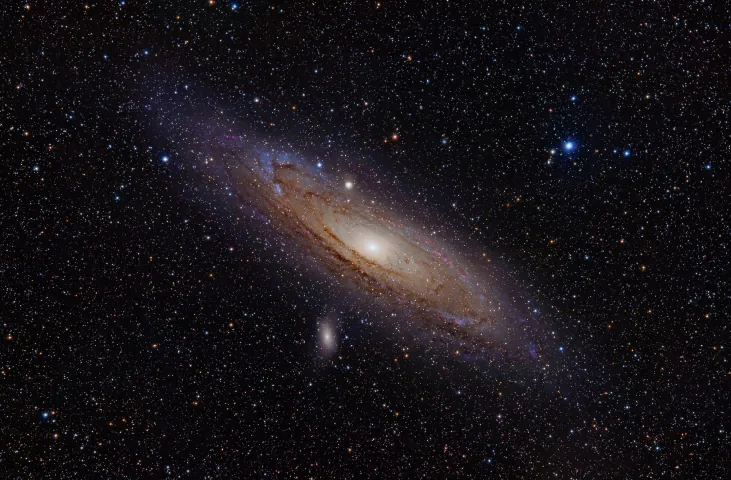 Visible Light Image of the Andromeda Galaxy (M31). The nearest large spiral galaxy to the Milky Way is slightly tilted from edge-on, allowing us to view the blue spiral arms as well as strong dust lanes that block some of the light from the central bulge.