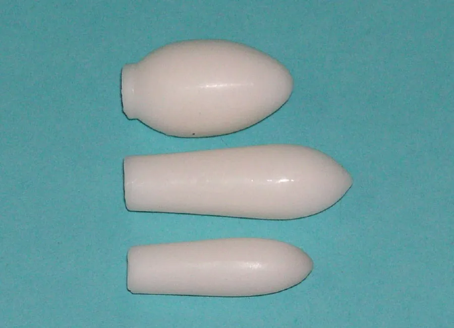 Suppositories in three different sizes. Showing from the top to the bottom a vaginal ovula (normal weight: 3 grams), a suppository for adults (normal weight: 2 grams) and a suppository for children (normal weight: 1 gram).