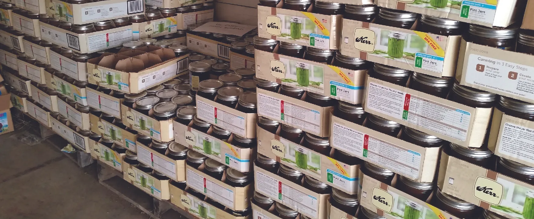 A photograph shows boxes of canning jars.