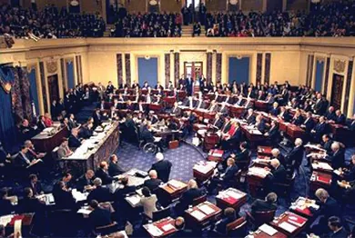 A photograph shows an aerial view of proceedings on the Senate floor during Bill Clinton’s impeachment trial.