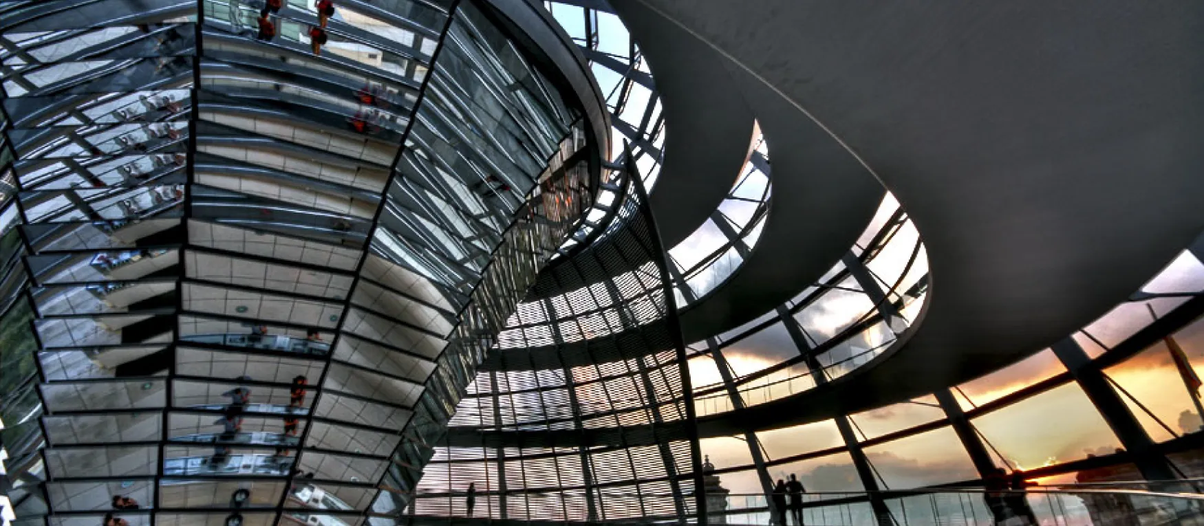 Photo of large atrium with windows and mirrors.