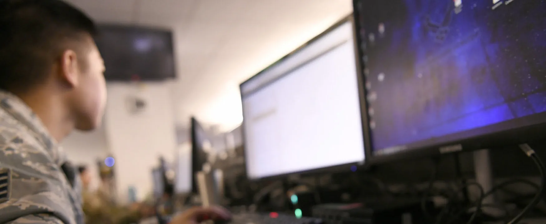 A photo of an individual using a computer.