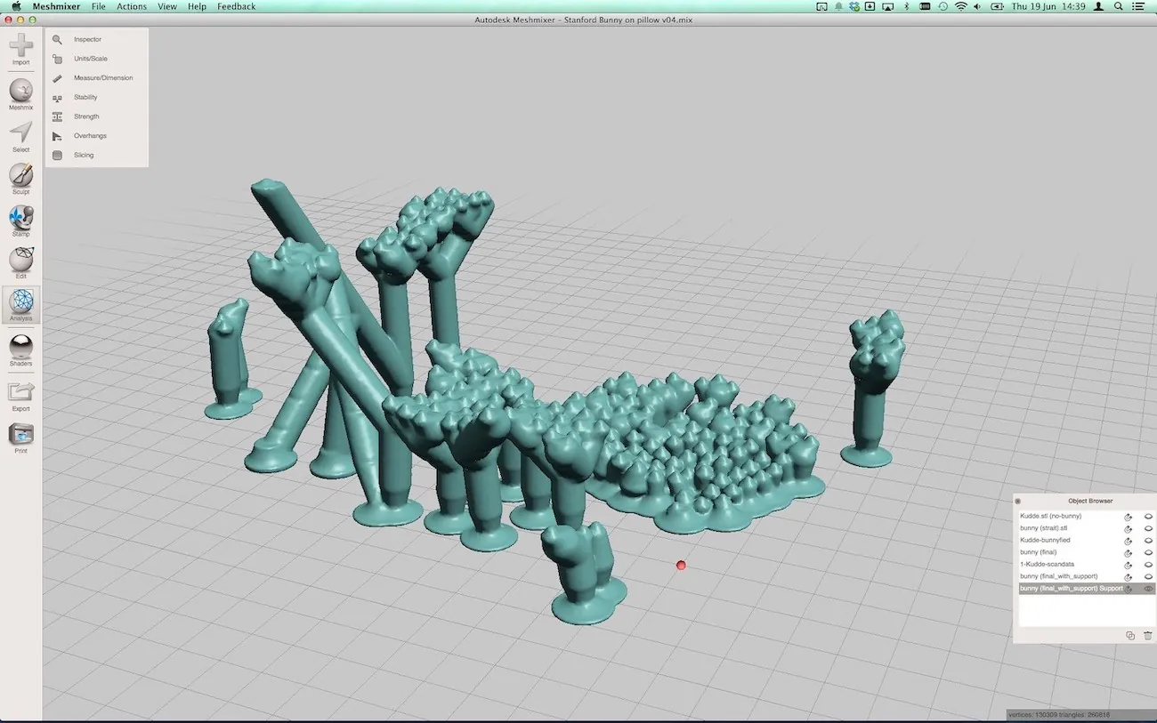 An autodesk software screen with a number of three dimensional shapes, most of which resemble small columns with a textured or bumpy surface on the top. Taller columns stand to the left, and a denser cluster of shorter items is on the right. Various software menus and displays appear around the main shape.