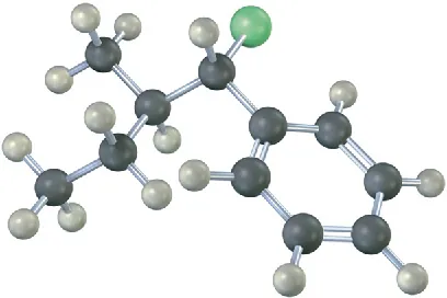 A ball-and-stick model of an alkyl chloride having a cyclohexane ring. The gray, black, green, and red spheres represent hydrogen, carbon, chlorine and bromine, respectively.