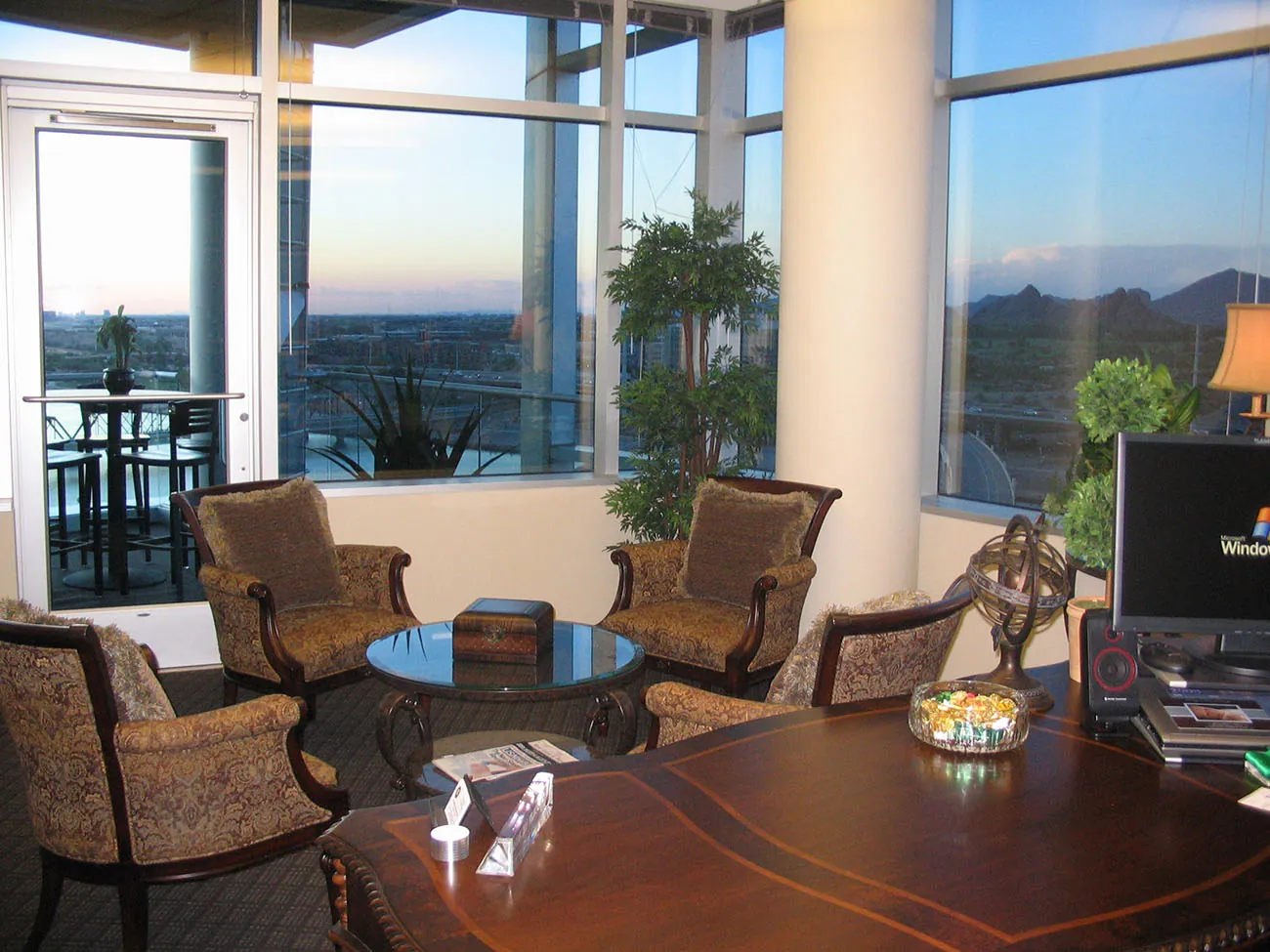 A photo shows a view of a corner office.