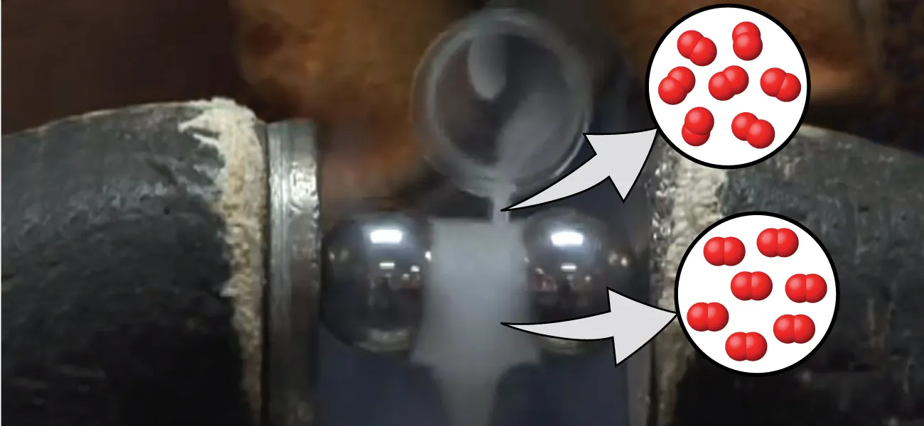 Se muestra una jarra que vierte oxígeno líquido a través del hueco entre dos imanes, donde ha formado un disco sólido. Un cuadro con leyenda cerca del chorro de oxígeno líquido muestra una imagen de seis pares de esferas, separadas unas de otras. Otro cuadro con leyenda cerca del disco sólido muestra diez pares de esferas mucho más cercanas.