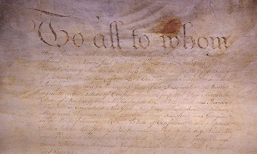An image of an original handwritten version of the Articles of Confederation.