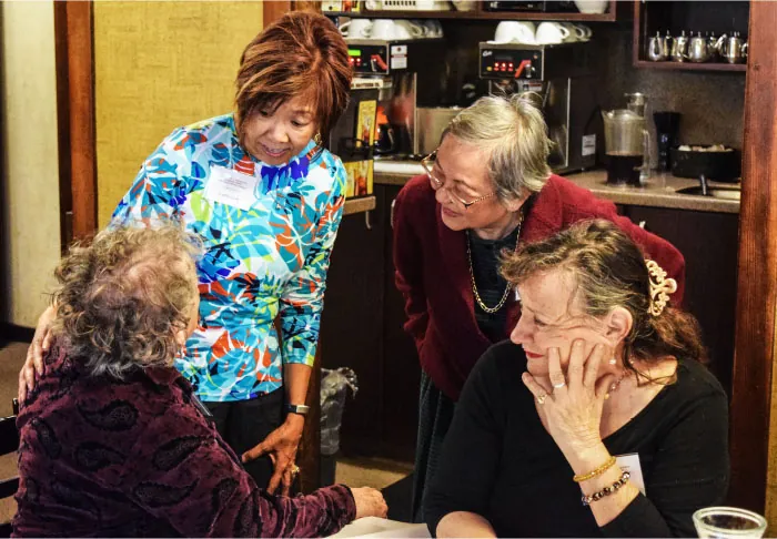 A group of older adults socializing.
