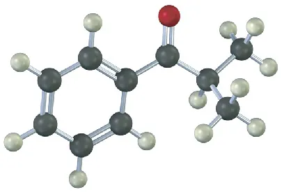 The ball-and-stick model shows a benzene ring single-bonded to a carbonyl carbon single-bonded to an isopropyl group. Black, gray, and red spheres represent carbon, hydrogen, and oxygen, respectively.