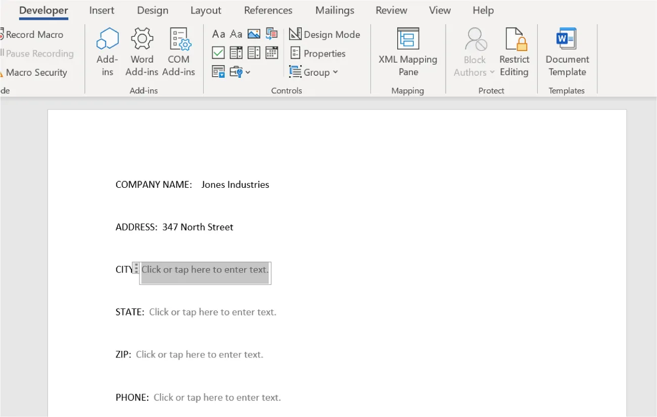 A fillable form displays. Company Name and Address have information provided. Click or tap here to enter text is visible in a gray font next to other prompts.