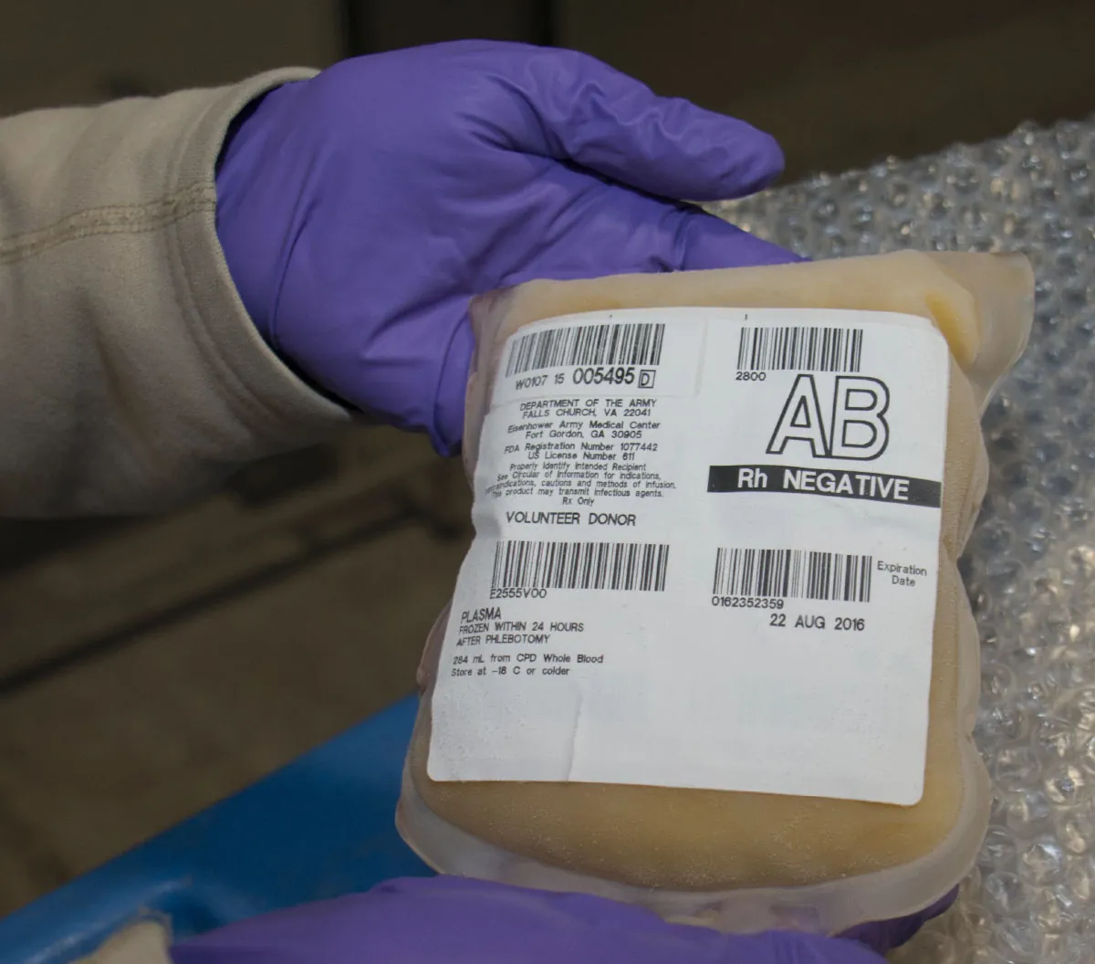 A photograph shows a bag of plasma with label.