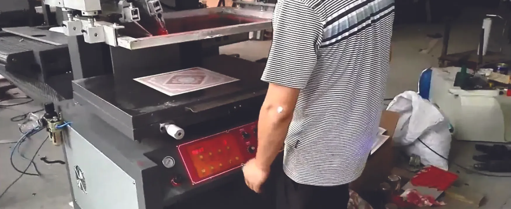 Man standing in front of large machine.