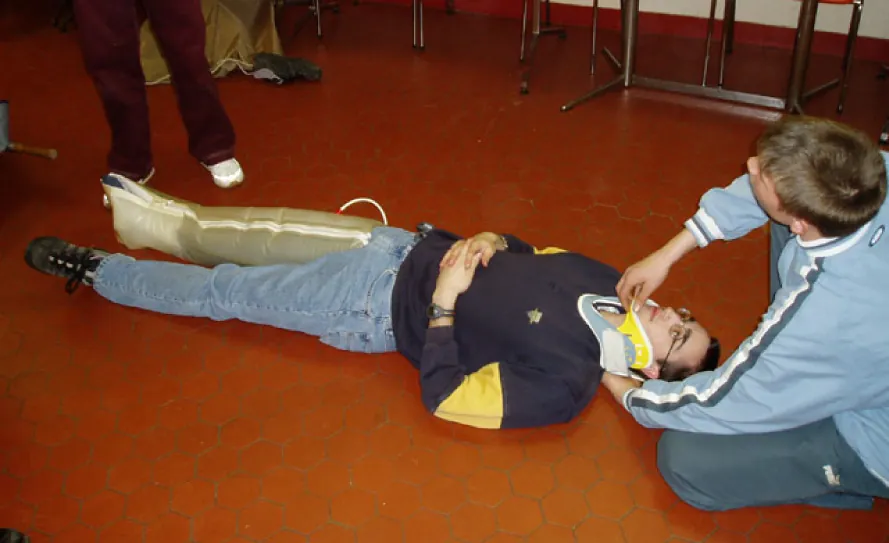 EMS placing cervical collar on patient