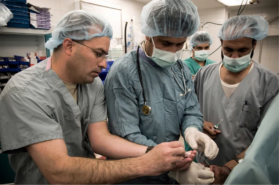 Healthcare professionals collaborating while providing care to patient