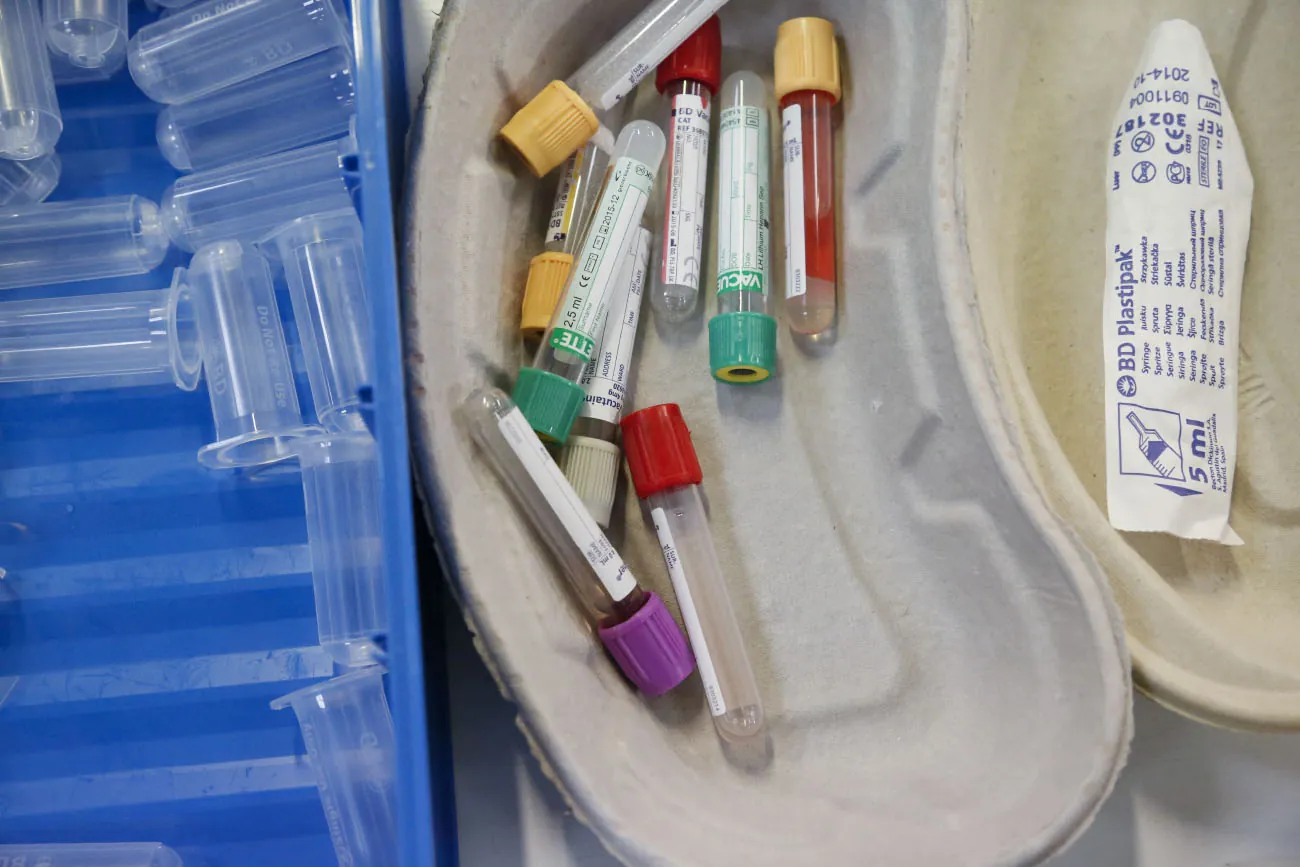 A photo of different types and colors of tubes to collect blood.