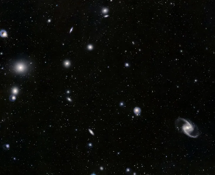 Image of the Fornax Cluster of Galaxies. Many elliptical and spiral galaxies are scattered throughout the image.
