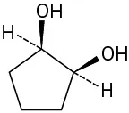 In a cyclopentane ring, C1 and C2 are each wedge bonded to a hydroxyl group and dash bonded to a hydrogen atom.
