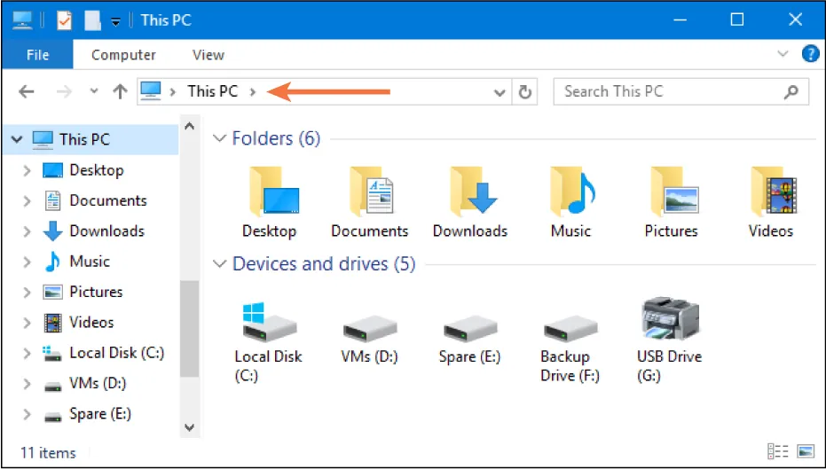 File is selected in File Explorer. A bar displays This PC. A Search Bar is at the right. Folders menu shows options and Devices and Drives options display at the bottom.