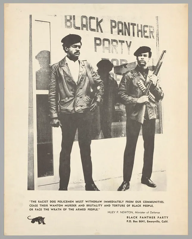 Bobby Seale (left) and Huey P. Newton (right) stand in front of a poster for the Black Panther Party. Huey P. Newton holds a rifle.