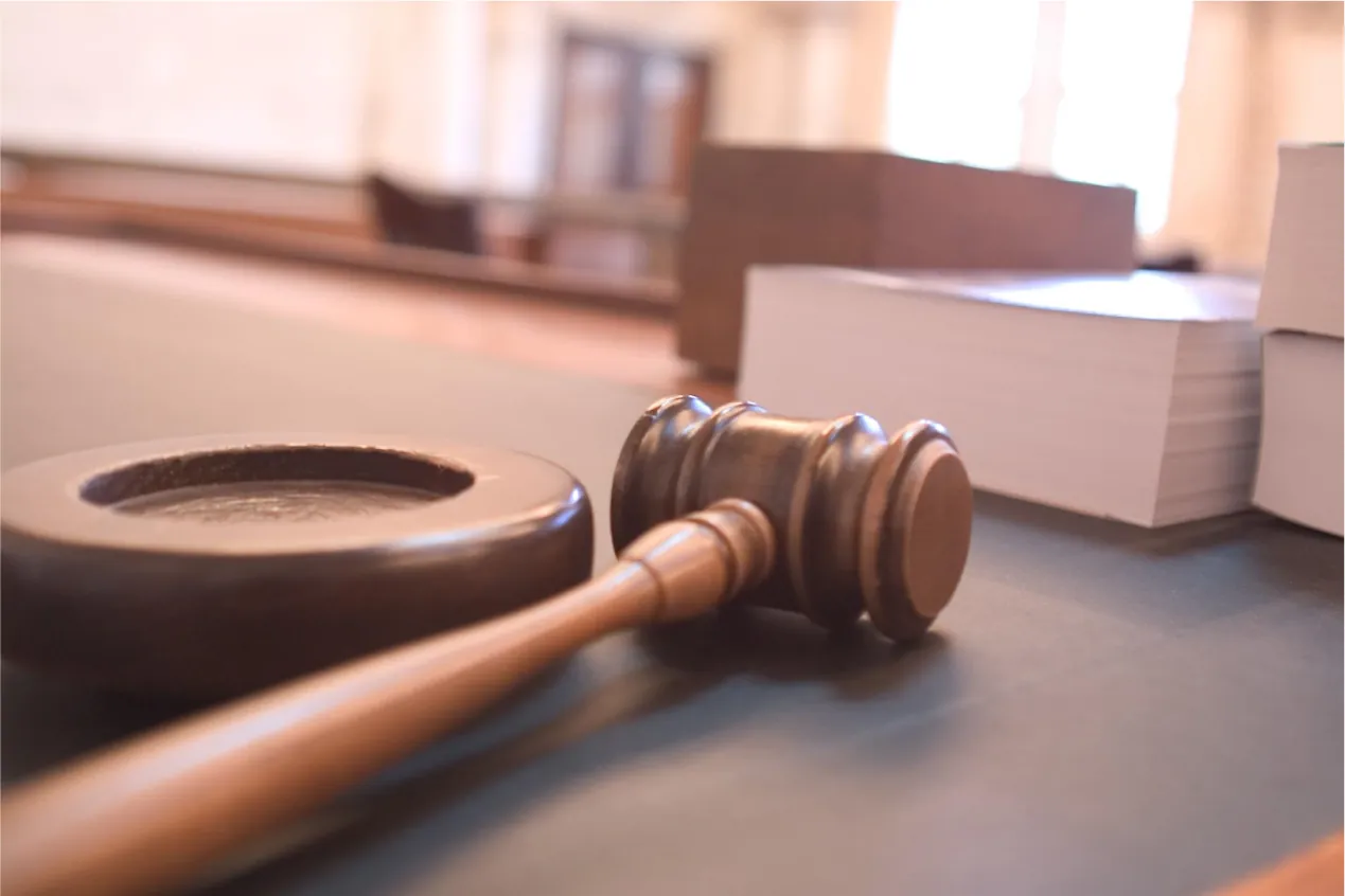 A gavel on a desk.