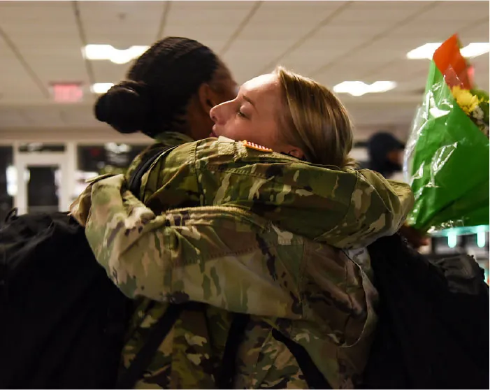 Photo of two individuals hugging.