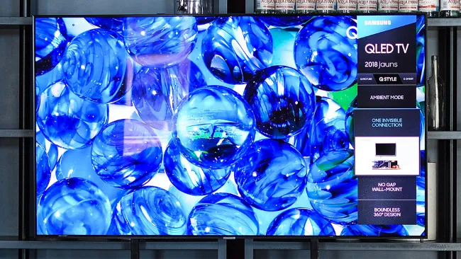 Photo shows a large-screen Samsung QLED television.