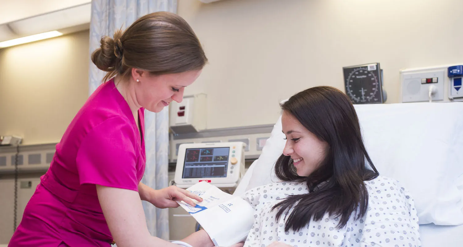 Nurse measuring patient's blood pressure.
