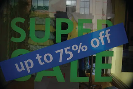 The figure shows a sale sign with a discount rate