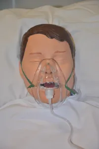 An image of a person’s face with a simple mask.