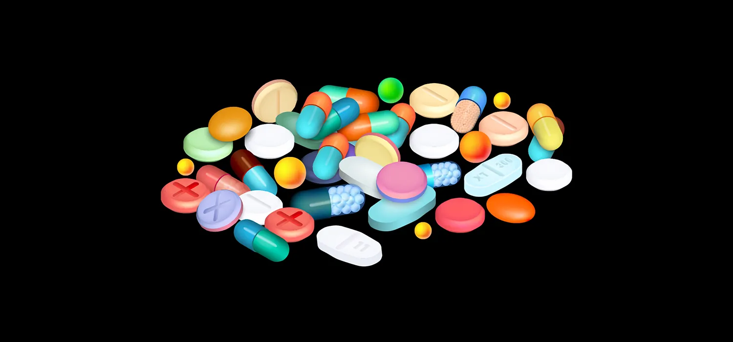 Different pills in a pile. There are round, oval, and capsule shaped pills in different sizes and colors.