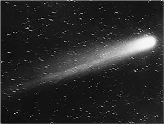 Esta es una imagen del cometa Halley. Es una bola de luz brillante que va hacia la derecha de la imagen con una cola de luz. También hay estrellas en todo el cuadro.