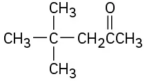 The structure of 4,4-dimethyl-2-pentanone where the carbonyl group is located at C 2 and two methyl groups at C 4.