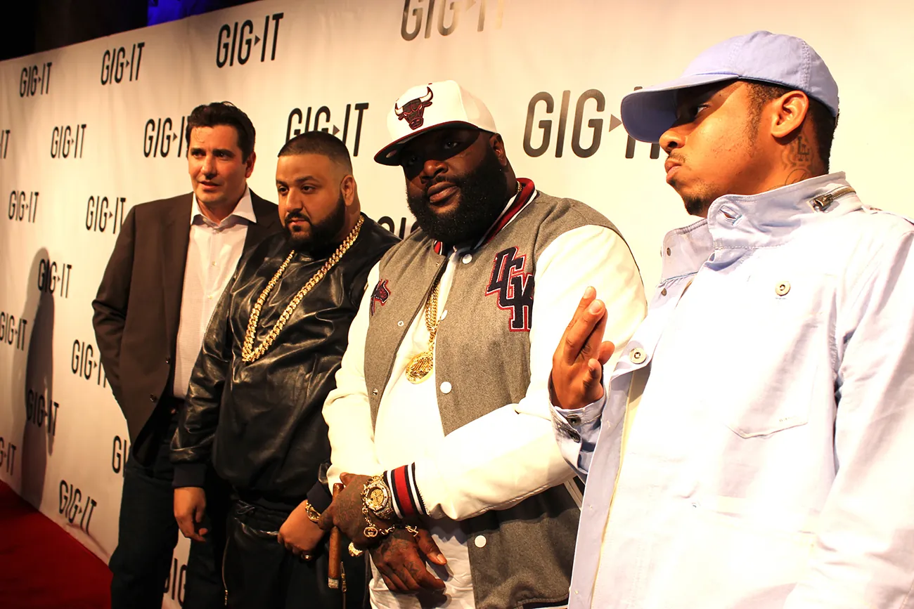 A photograph shows D J Khaled posing for a photo op with Rick Ross.