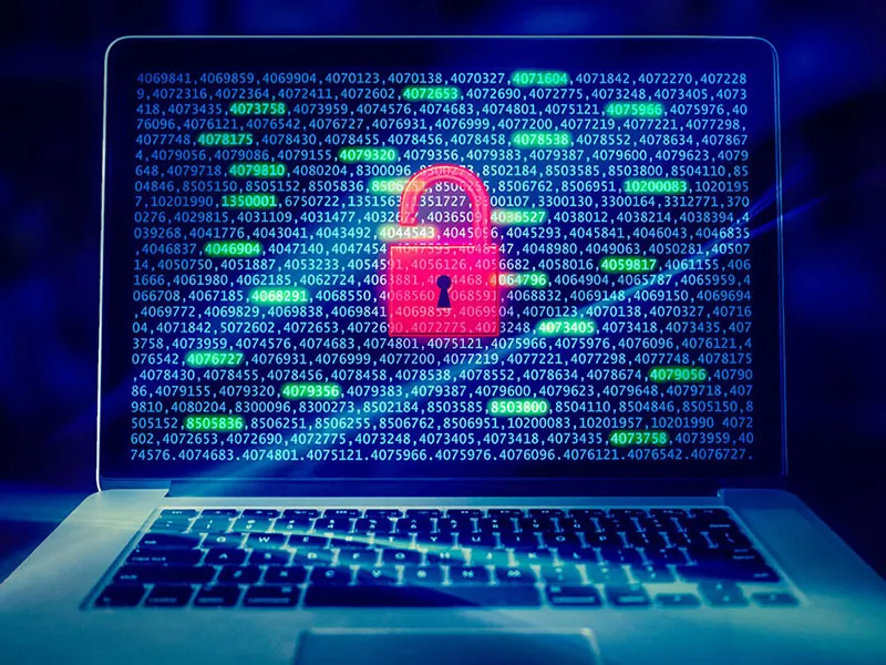 A laptop screen shows a lock symbol.