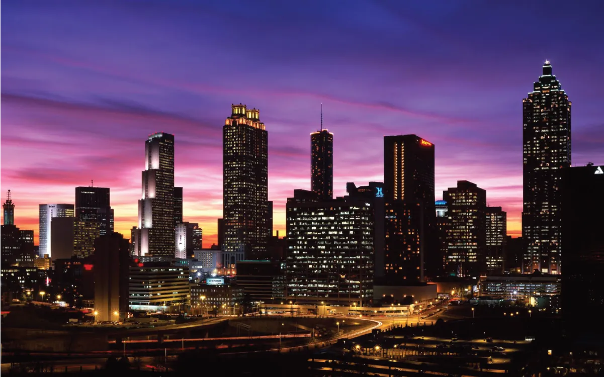Photo of a city skyline at dusk.
